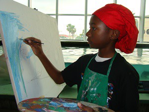 A student portrays on canvas the movements of a stingray after studying the animal at the Florida Aquarium in Tampa.